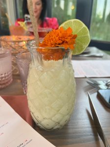 white cocktail in a glass pineapple