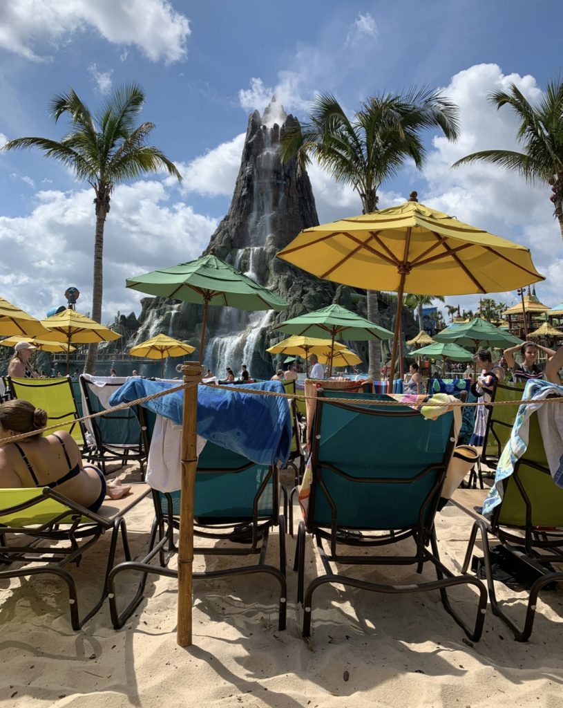 lots of loungers and umbrellas at the sandy part of volcano bay