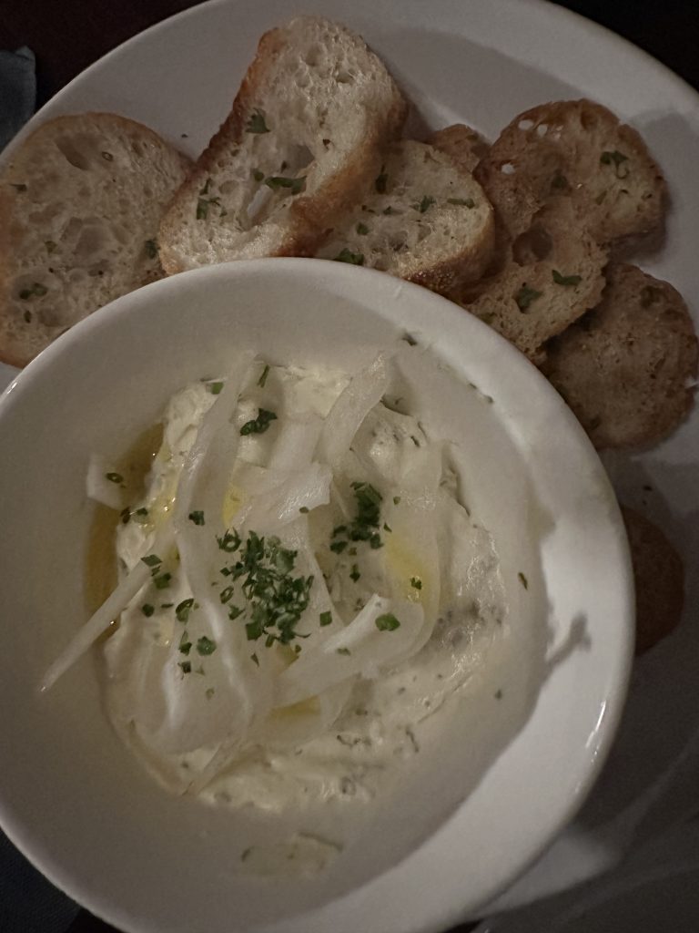 cheese dip with toasted baguette pieces