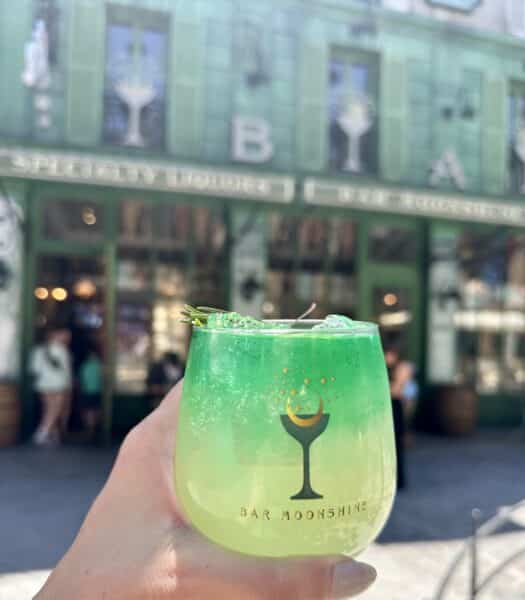 lobe blaster cocktail in front of bar moonshine in epic universe