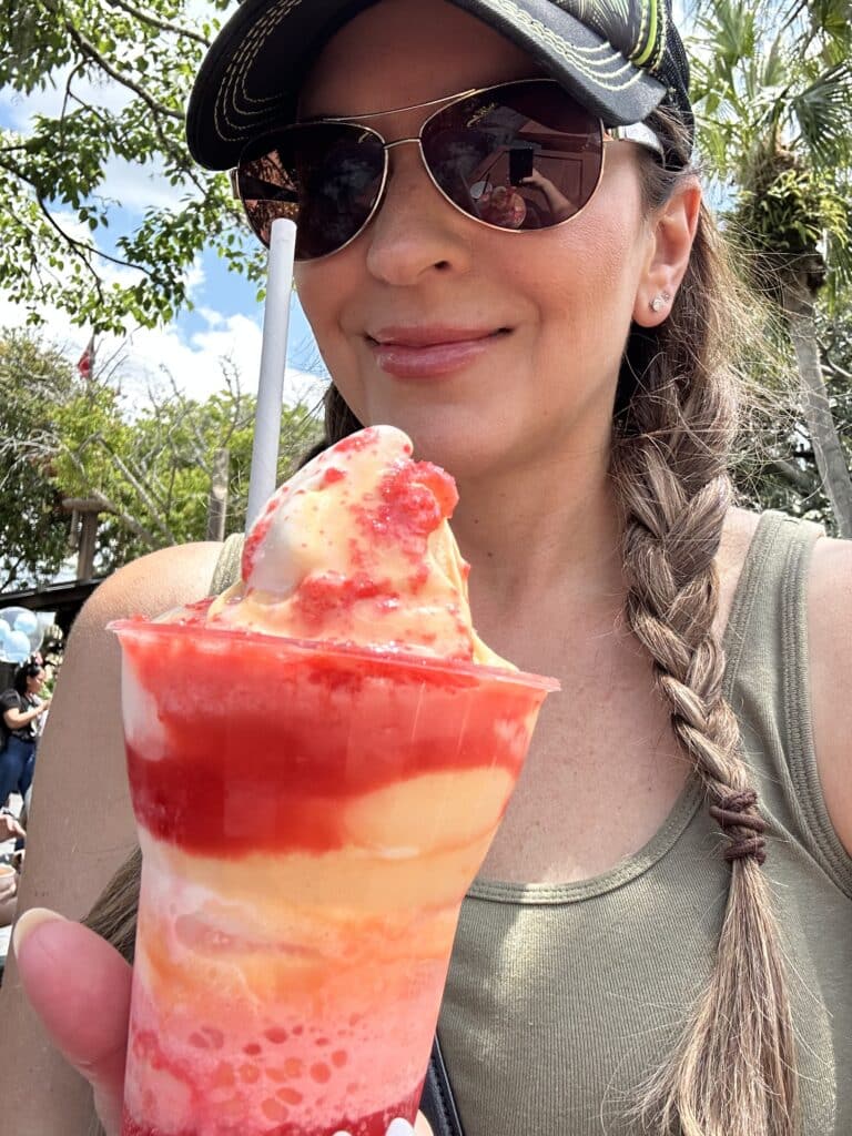 autumn eating a citrus swirl float at magic kingdom