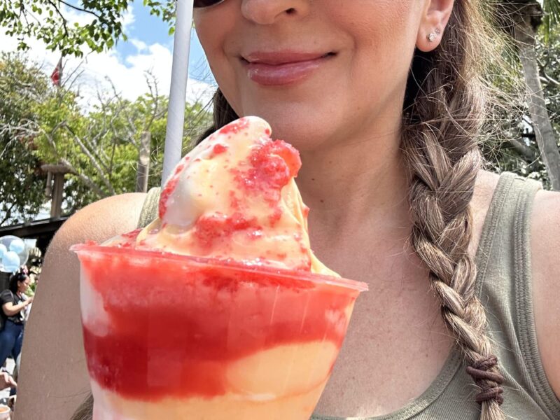 autumn eating a citrus swirl float at magic kingdom